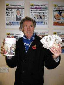 Barry Barnes, of the Wildfire Cork Lodge, gives £100 to Ribbons