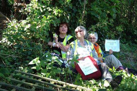 Three women chain themselves to trees beside Whitstable railway track