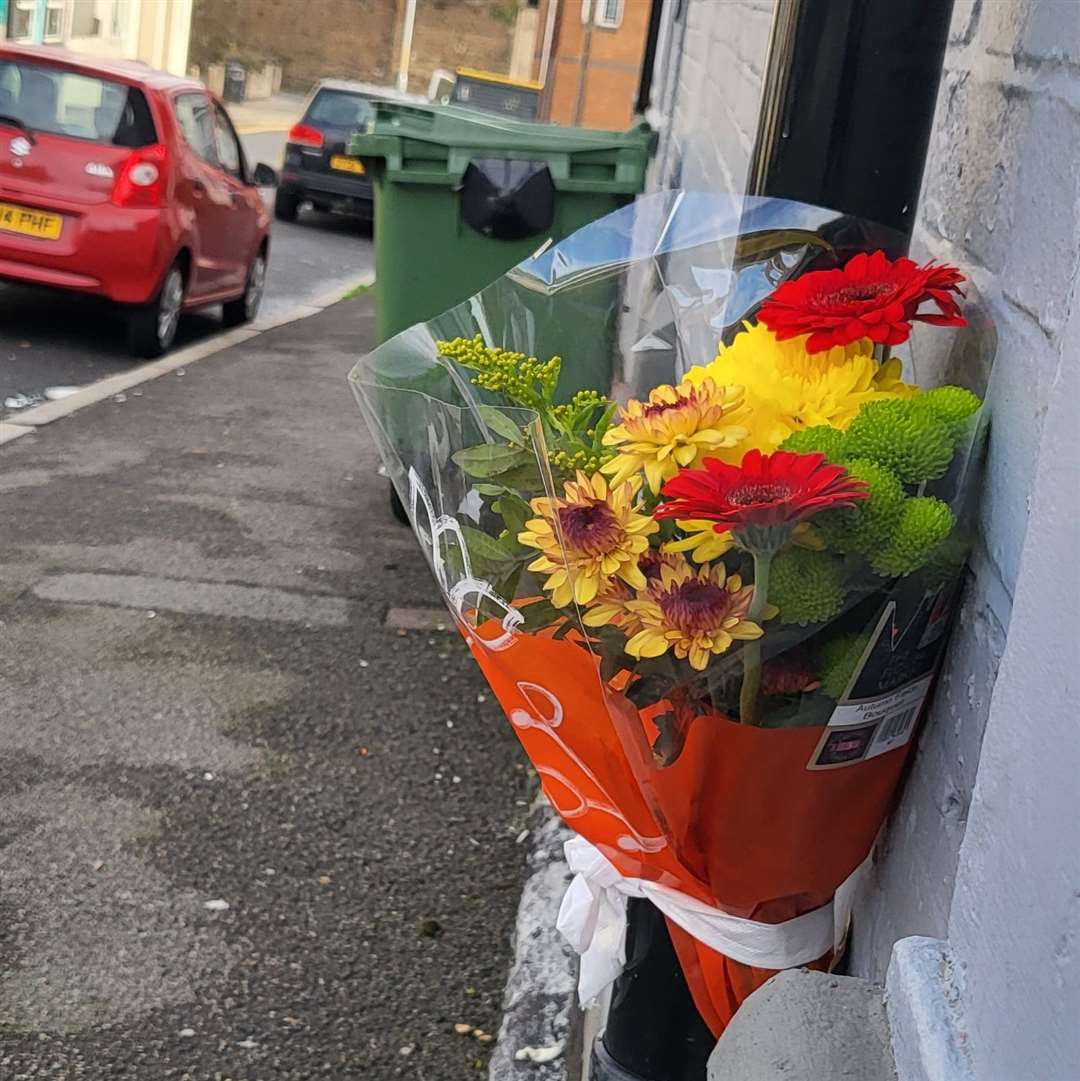 A floral tribute has been placed at the scene of a fatal 'street attack' in Folkestone