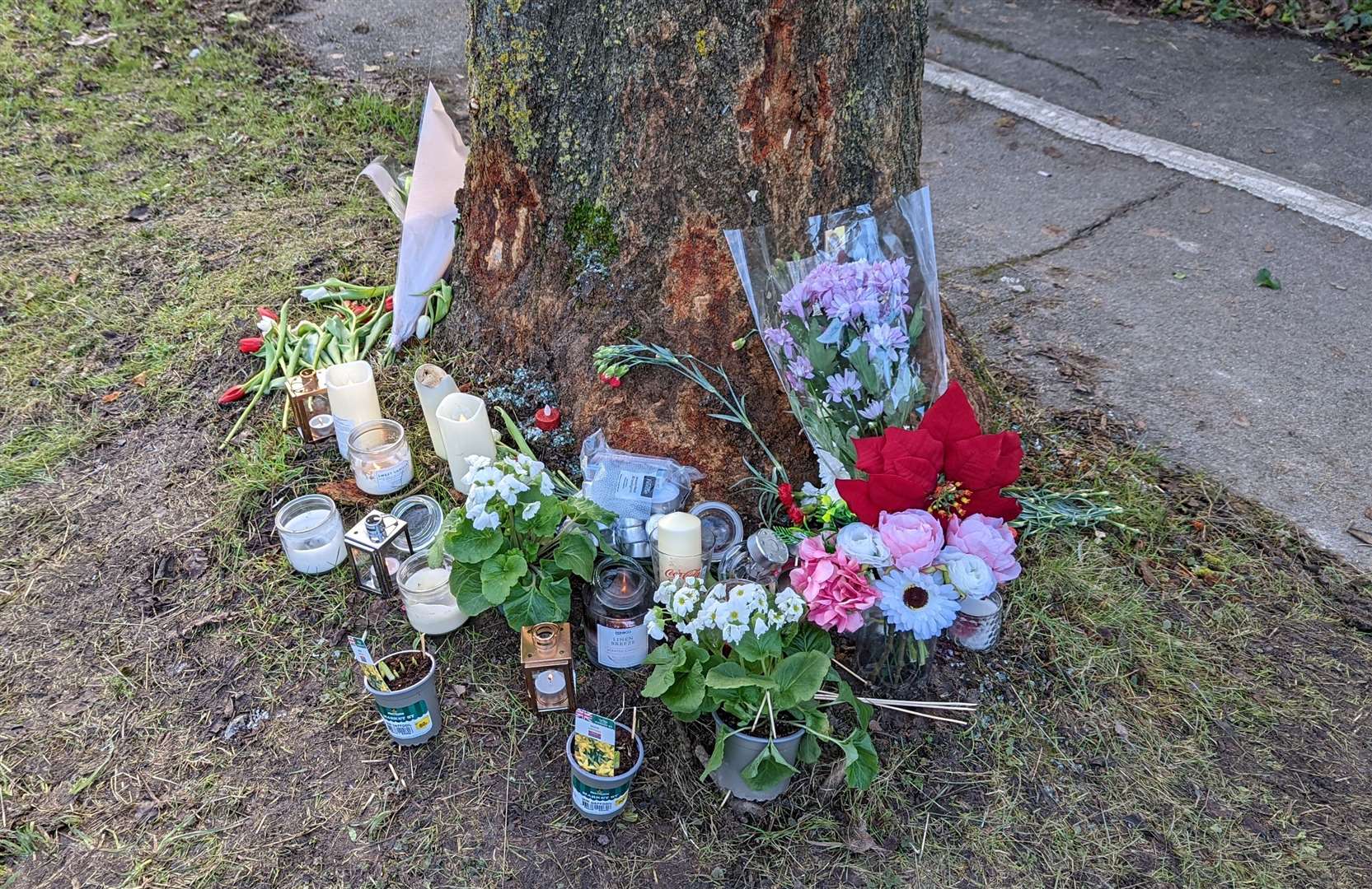 Floral tributes and candles left in memory of Razvan Costache