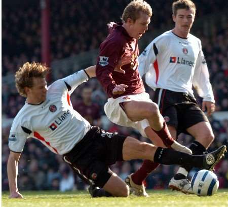 Arsenal's Alexander Hleb is tackled in the area by Jonathan Spector to avoid another Gunners goal scoring chance at Highbury. Picture by MATTHEW WALKER