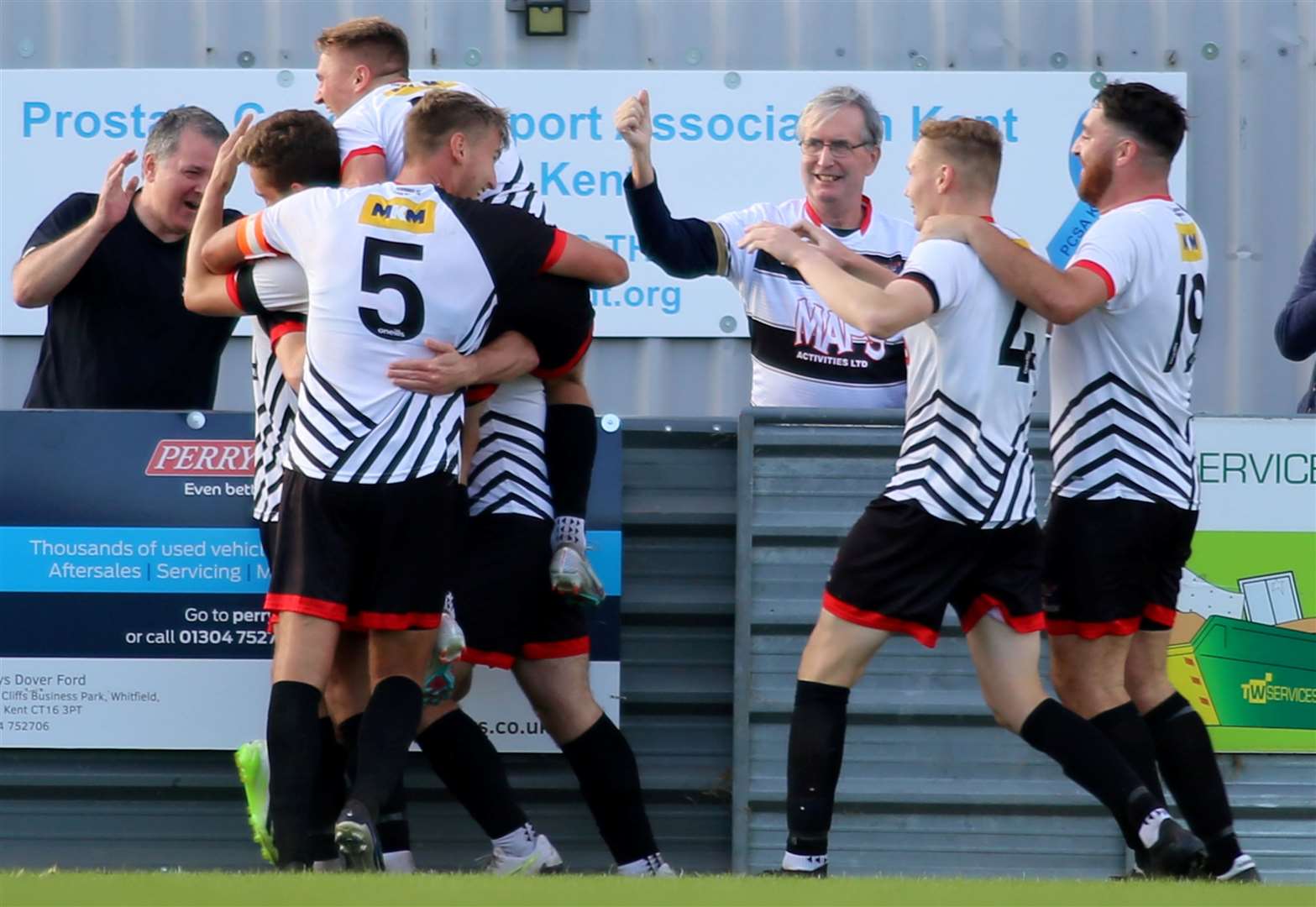 Deal Town celebrate Ben Chapman's late winner on his 200th club appearance. Picture: Paul Willmott