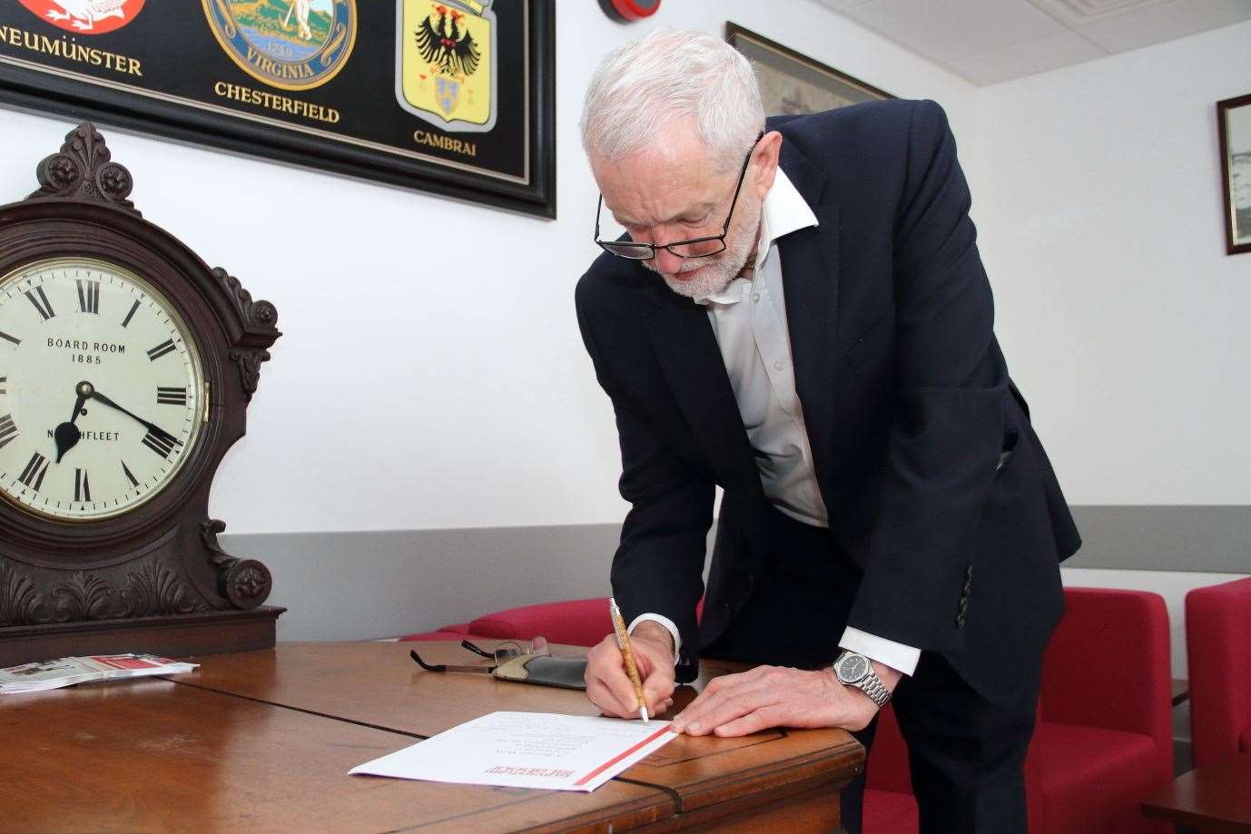 Jeremy Corbyn signs a copy of the Gravesham Labour group's manifesto