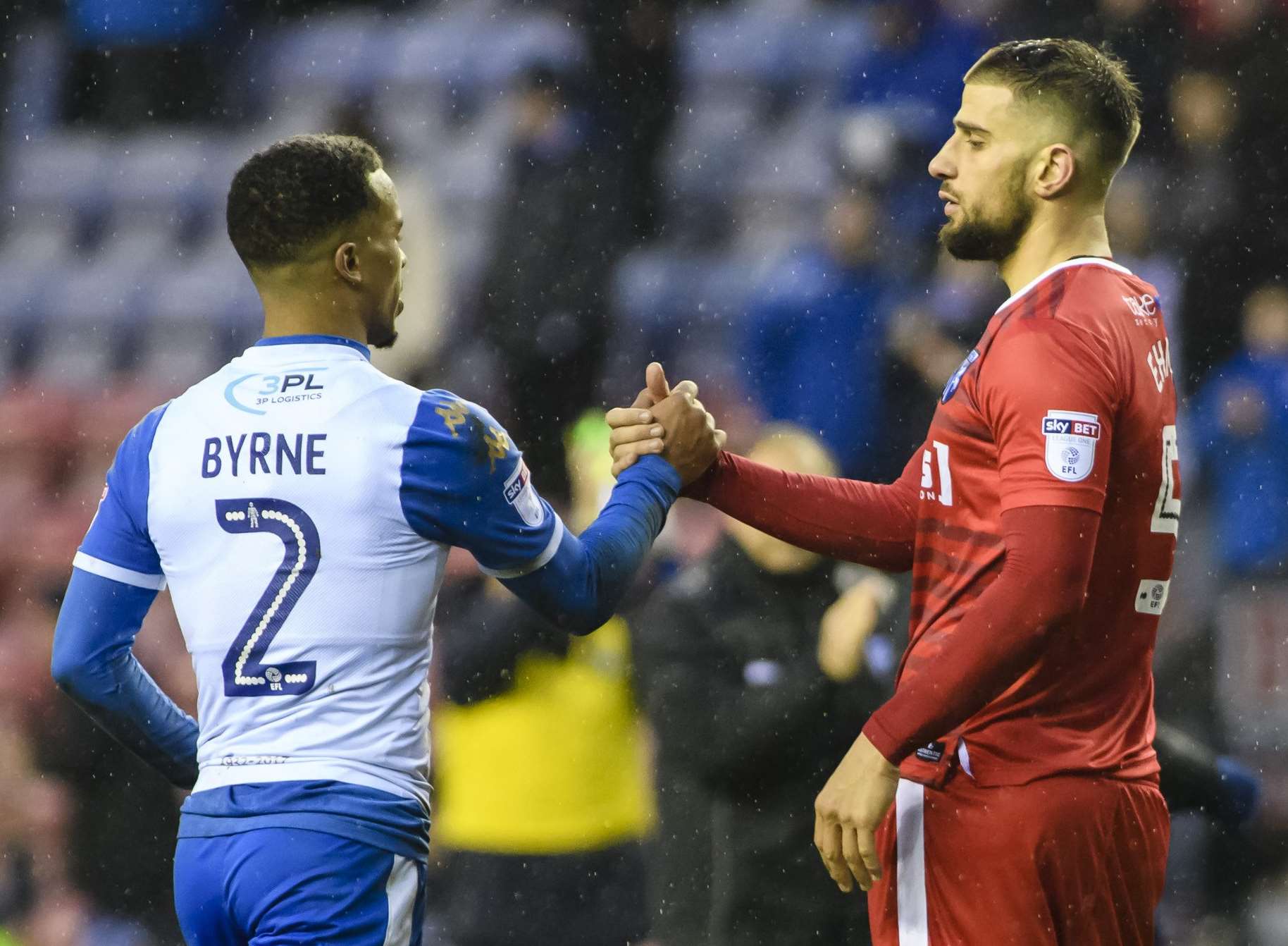 Max Ehmer congratulates Wigan's Nathan Byrne at full-time Picture: Andy Payton