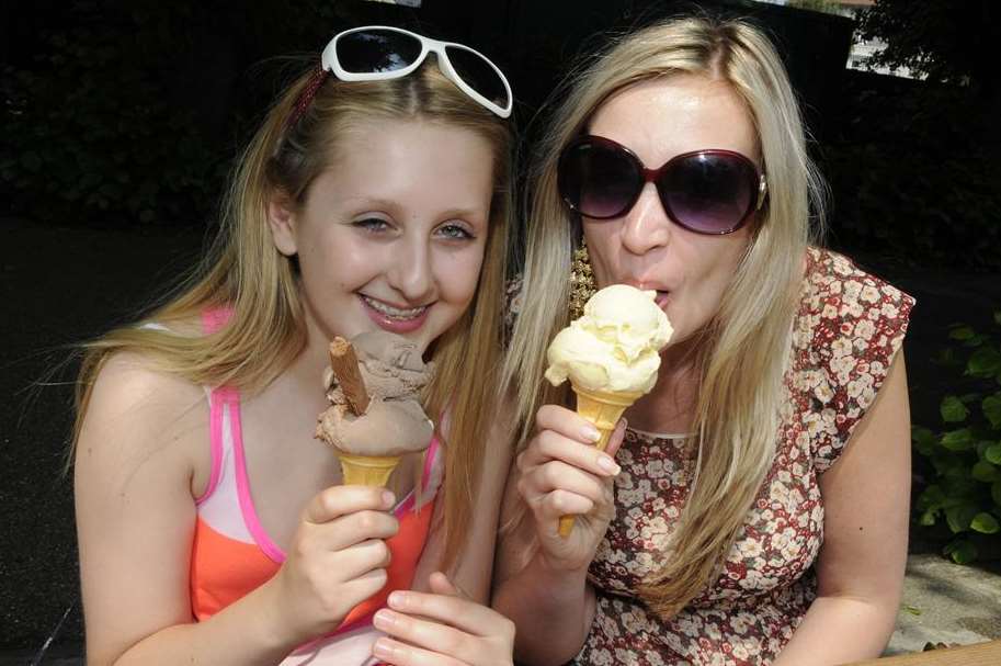 Olivia Hawkins and Rebecca Kemp cool off with an ice cream in Dane John Gardens, Canterbury