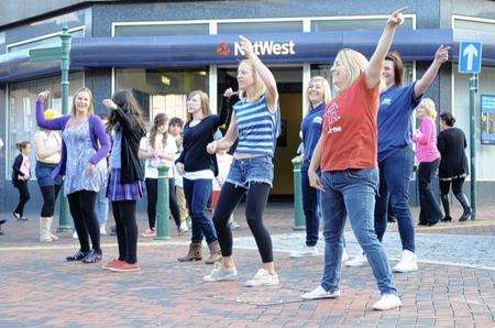 The flash mob performs in Sittingbourne High Street outside Nat West bank.
