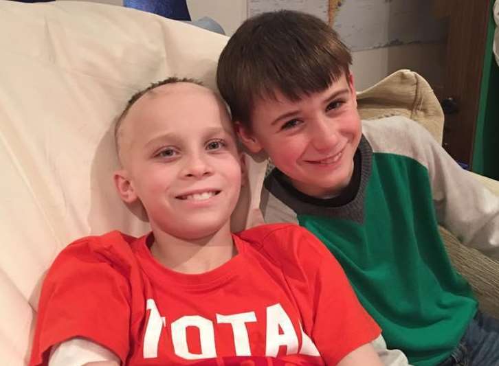 James Wilkinson, 10, with his poorly cousin John, 11