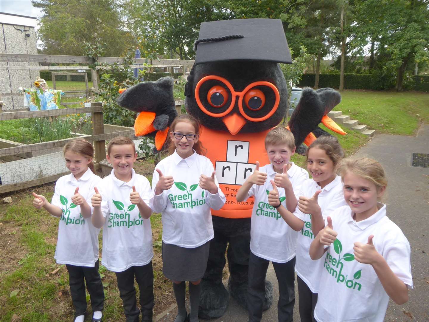Kingswood Primary's green champions with Three R's mascot Reggie the Owl. (4535394)