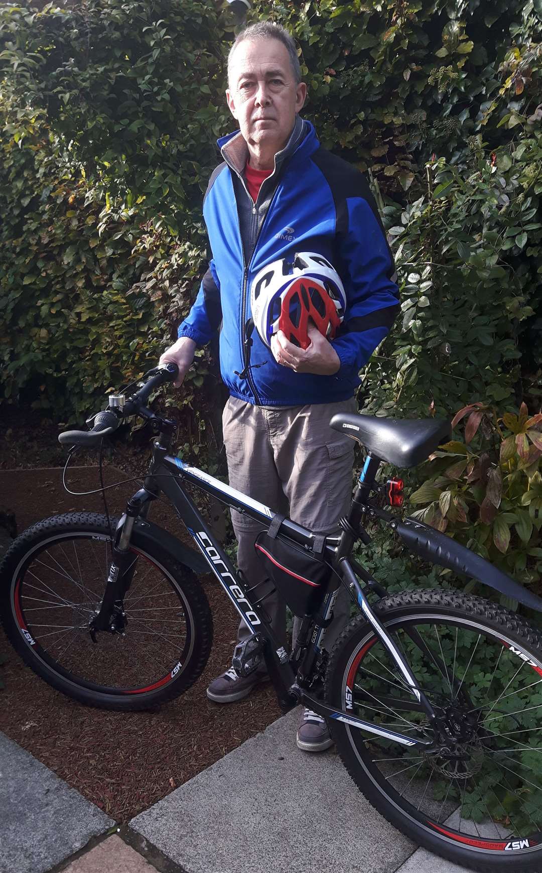 Ian Deal and his bike, wearing the clothes he wore on the day of the accident
