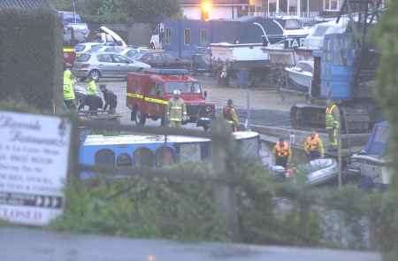 Firefighters and police at the scene. Picture: PAUL DENNIS