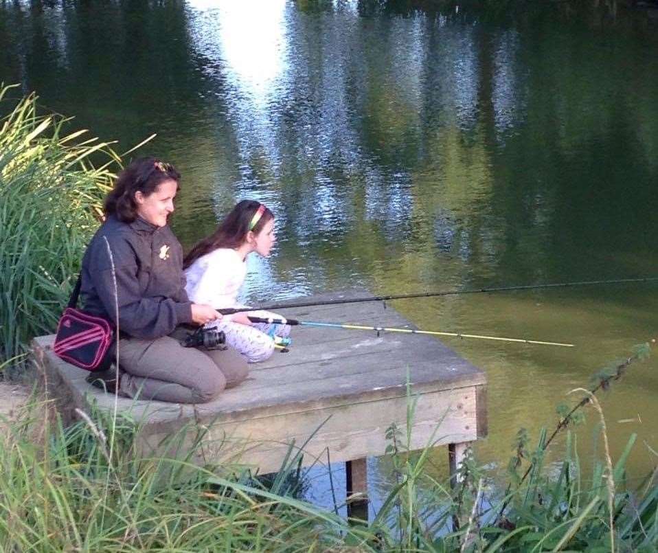 Joanne Frazier takes her daughter to the fishing spot