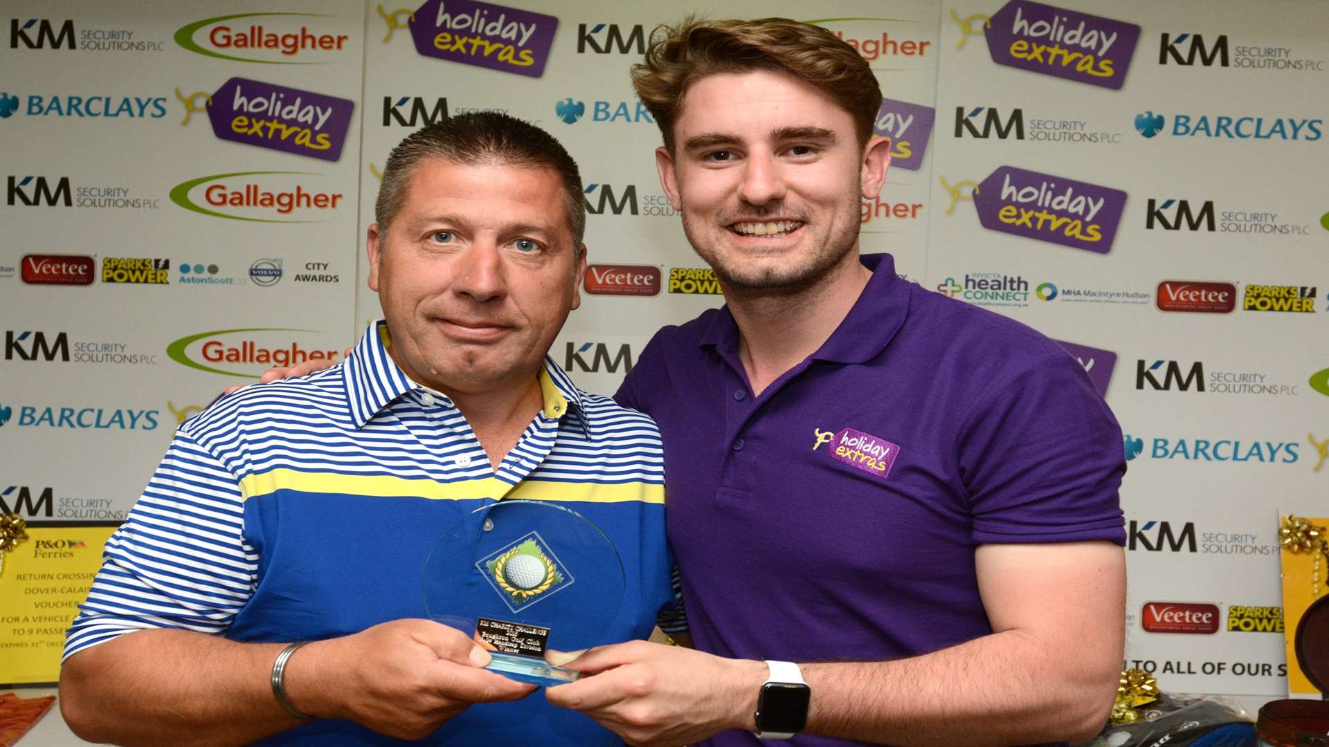 Sean Hagger of Holiday Extras presents Paul Bradley of Tony Kirwan Contractors, Ashford with the 13 - 24 Handicap prize at the KM Charity Golf Challenge 2016 staged at Boughton Golf Club On Friday, May 20.
