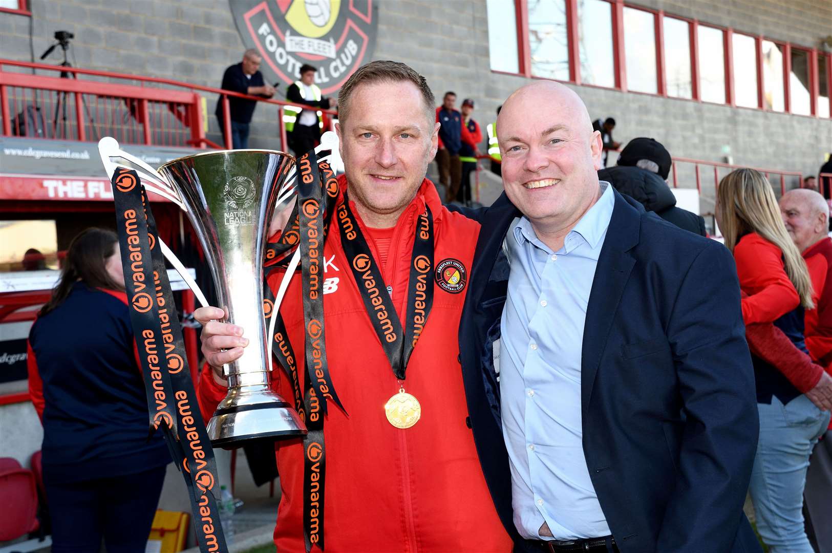 Ebbsfleet boss Dennis Kutrieb celebrates his side's 2022/23 National League South title win with chief executive Damian Irvine. PIcture: Simon Hildrew