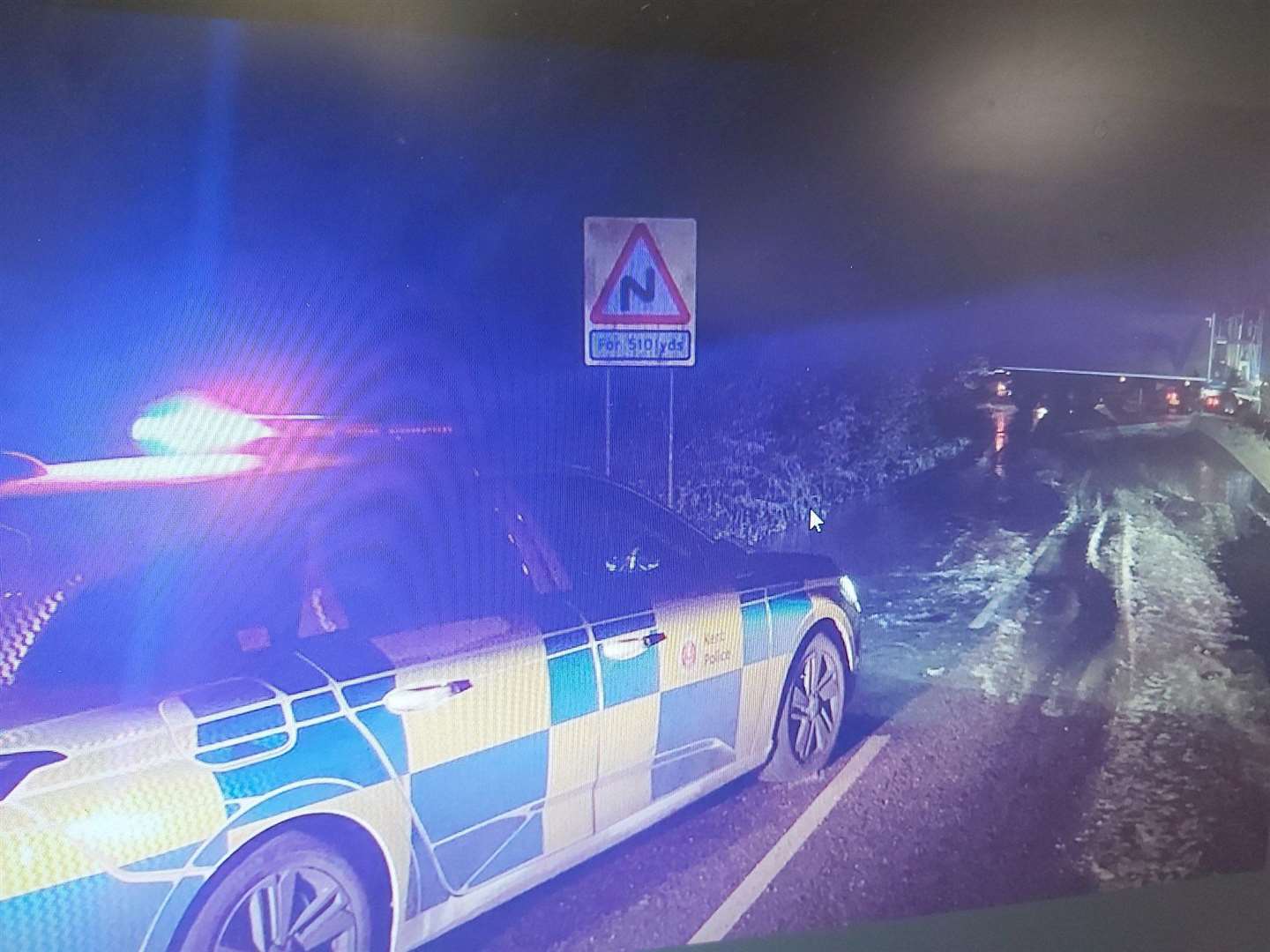 Police at the scene of a jackknifed lorry