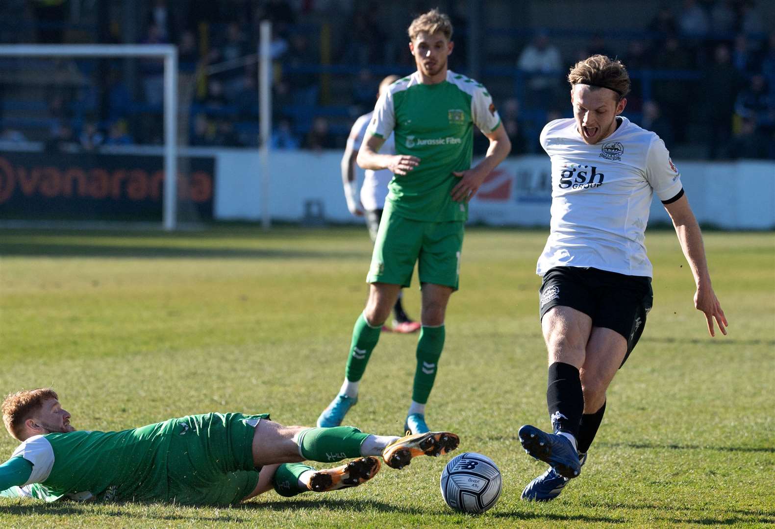 Dover defender Danny Collinge battles with a Glovers player for the ball. Picture: Stuart Brock