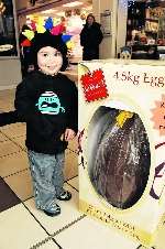 Aiden Law, two, demonstrates how big the egg is