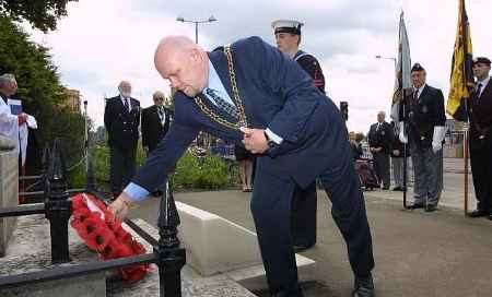 Cllr Mick Constable lays a wreath. Picture: JOHN WESTHROP