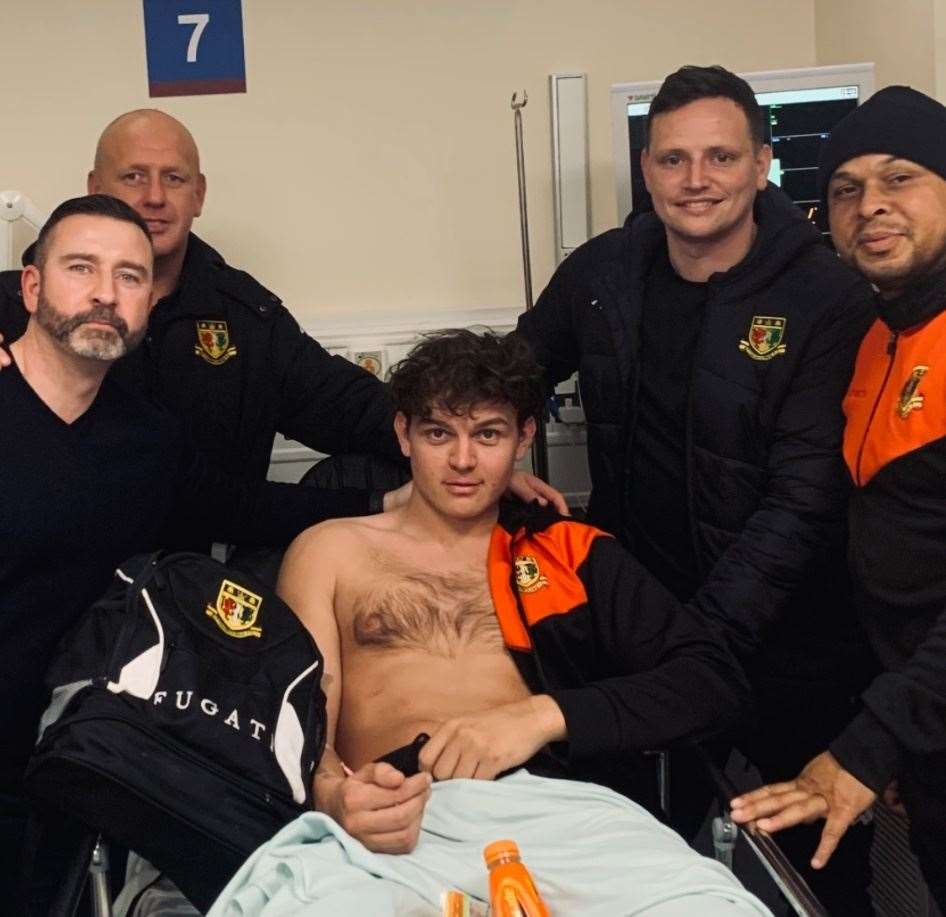 Michael Turner in hospital with the Sittingbournemanagement team Picture: Sittingbourne FC