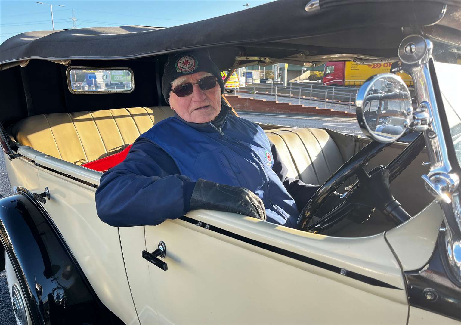 While his father Peter White, 88, drove his 1930s Buick in the parade
