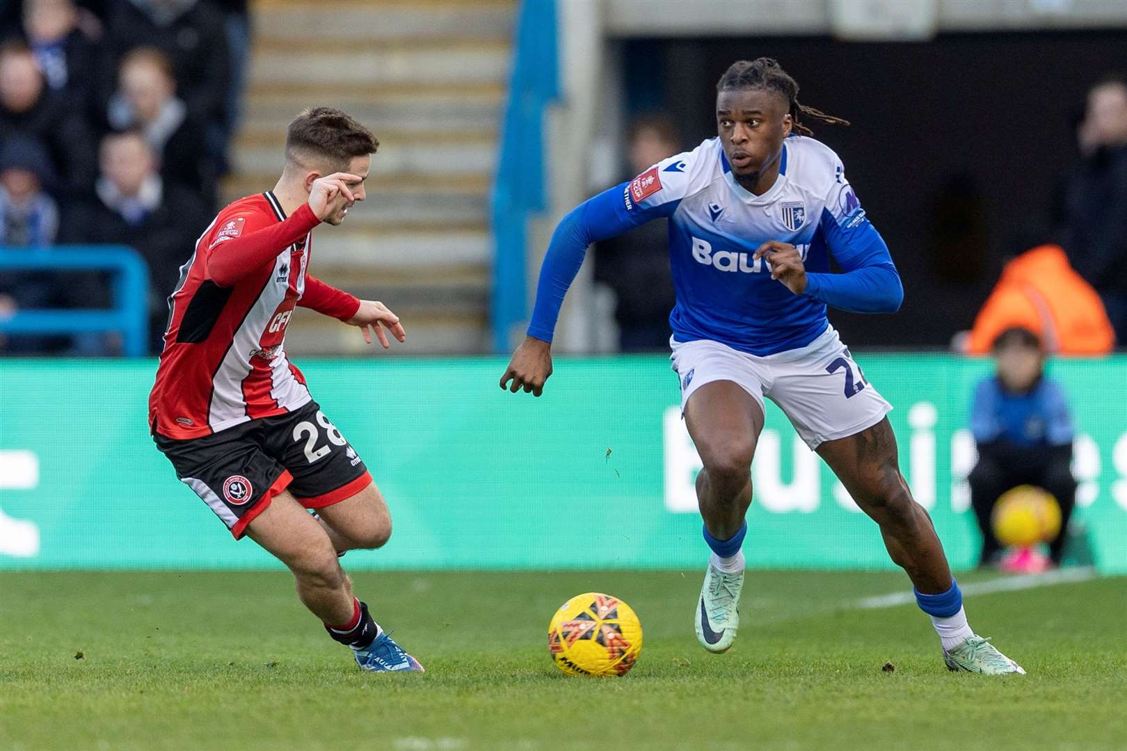 Shad Ogie looks to take his man on as Gillingham went up against Sheffield United in the FA Cup third round Picture: @Julian_KPI