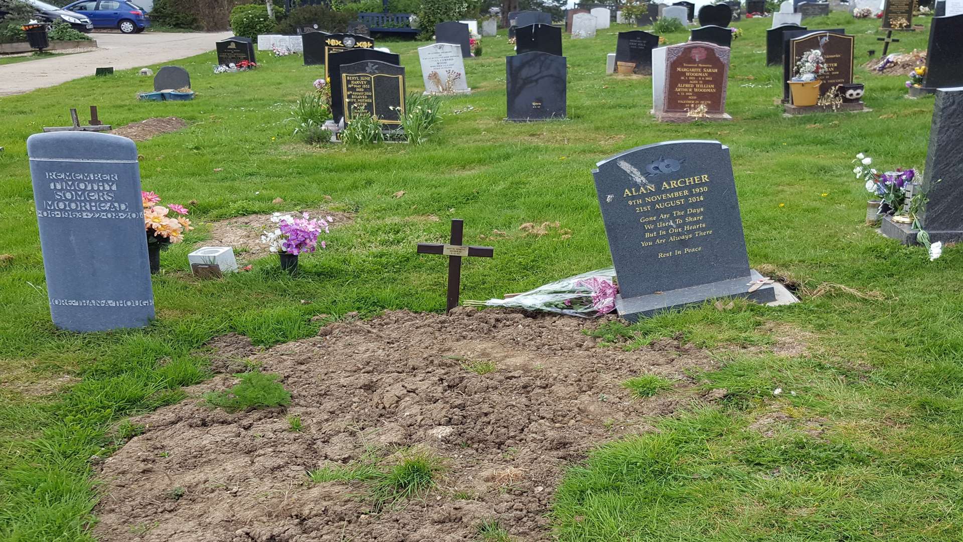 Alan Archer's headstone is now toppling over.