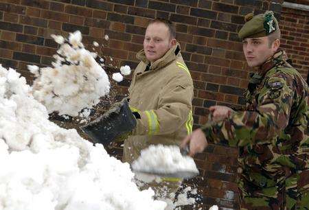 Clearing snow: from left; Firefighter Neil Dickson, Pte Paul Ross