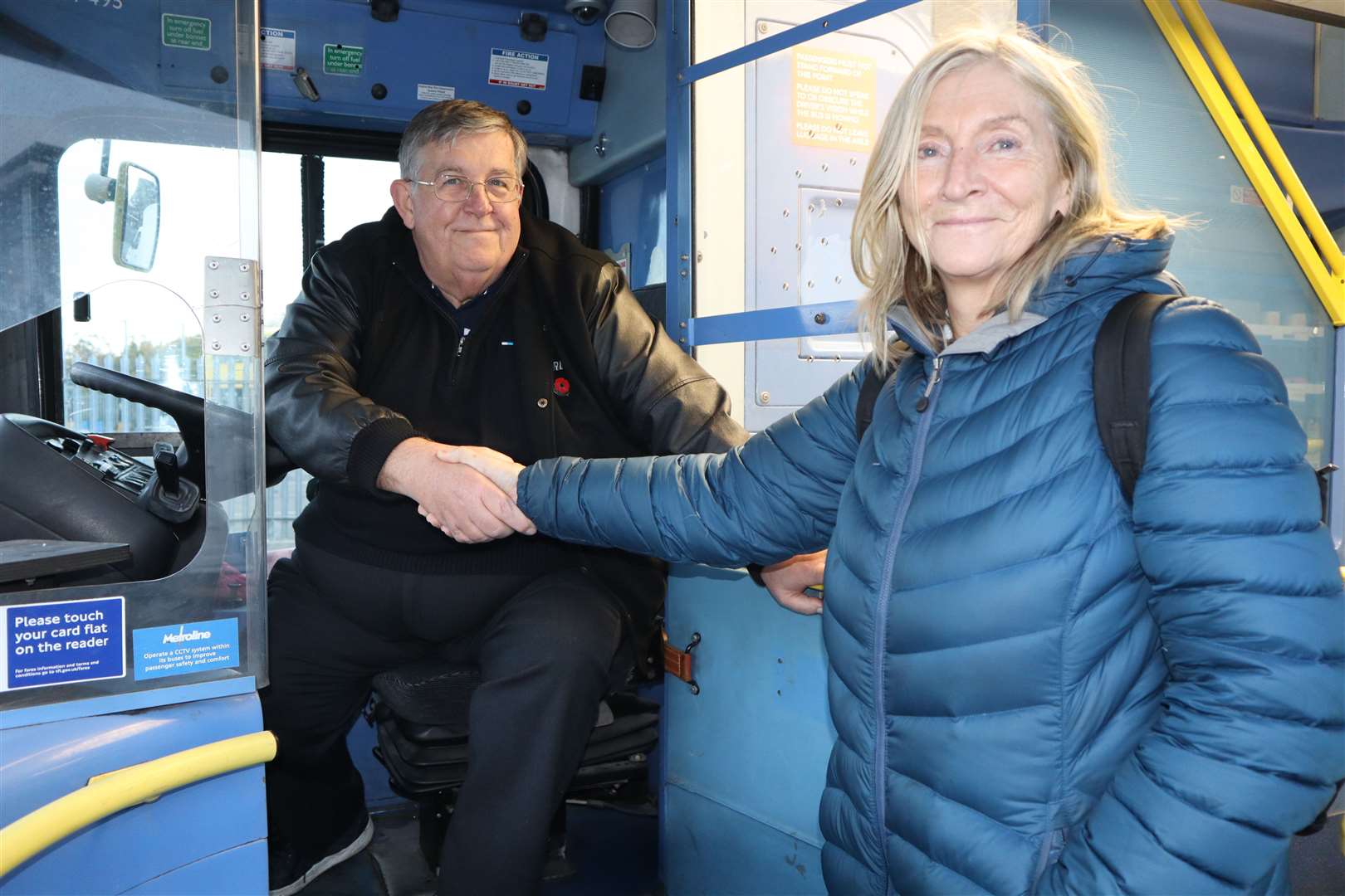 Driver Mike Riley welcomes Baroness Rosie Boycott aboard the Sheppey Support Bus