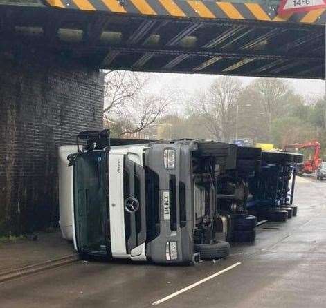 A lorry has overturned after hitting a railway bridge. Picture: Gary Westwell