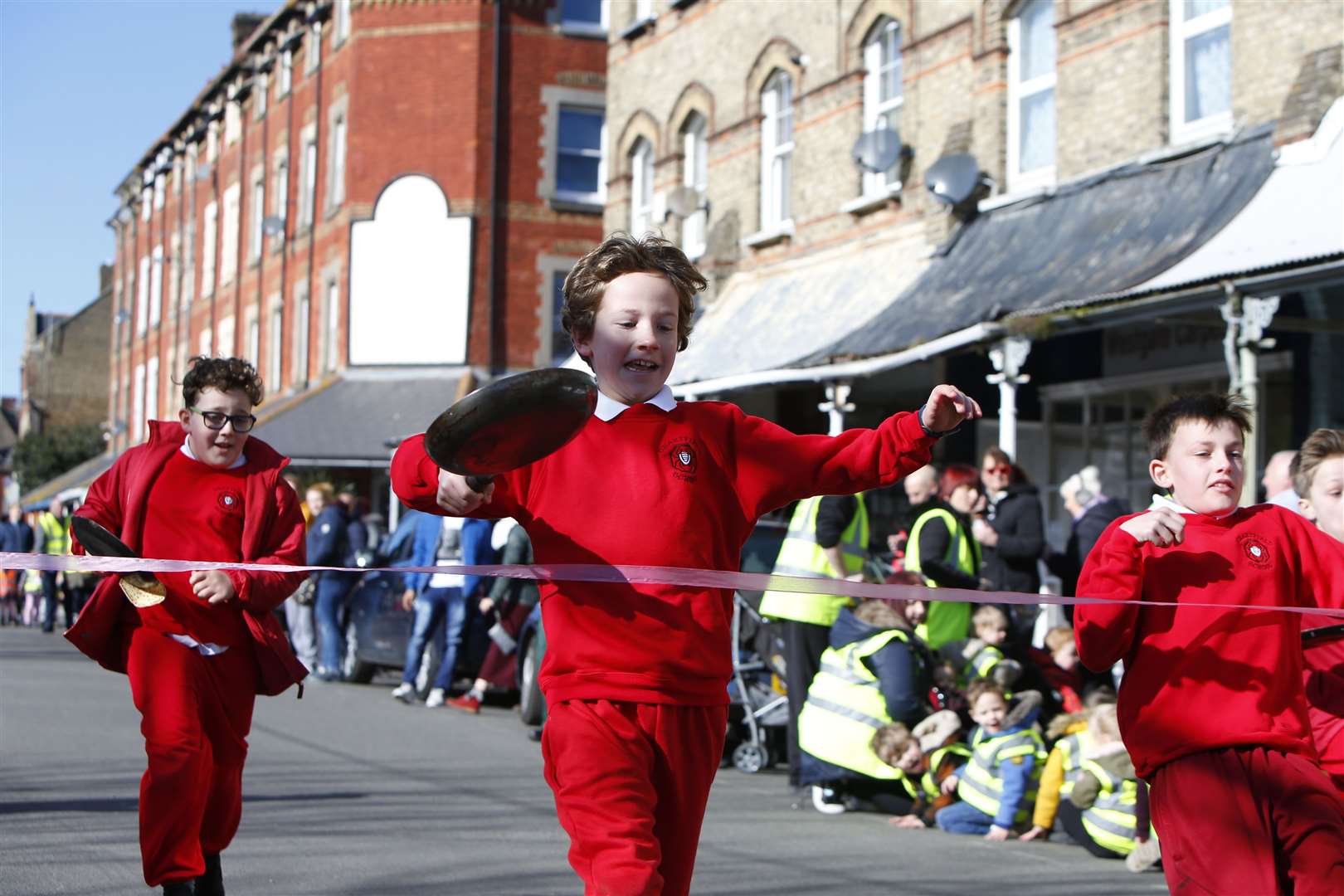 Children race to the finish line at the Westgate pancake race last year