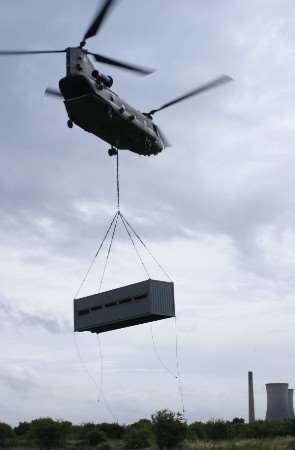 An RAF helicopter lowers the bird hide into place at the Sandwich and Pegwell Bay Nature Reserve