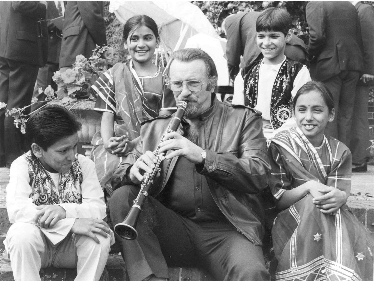 Jazz musician Acker Bilk joins Indian dancers at a charity garden party at the Walnut Tree in Yalding in September 1986