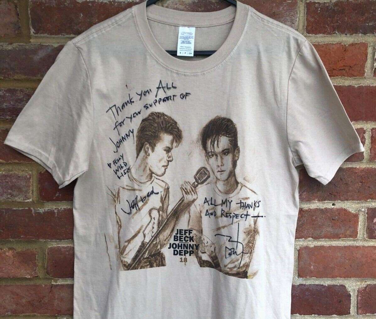 The T-shirt signed by Johnny Depp and Jeff Beck on eBay. Picture: Folly Wildlife Centre