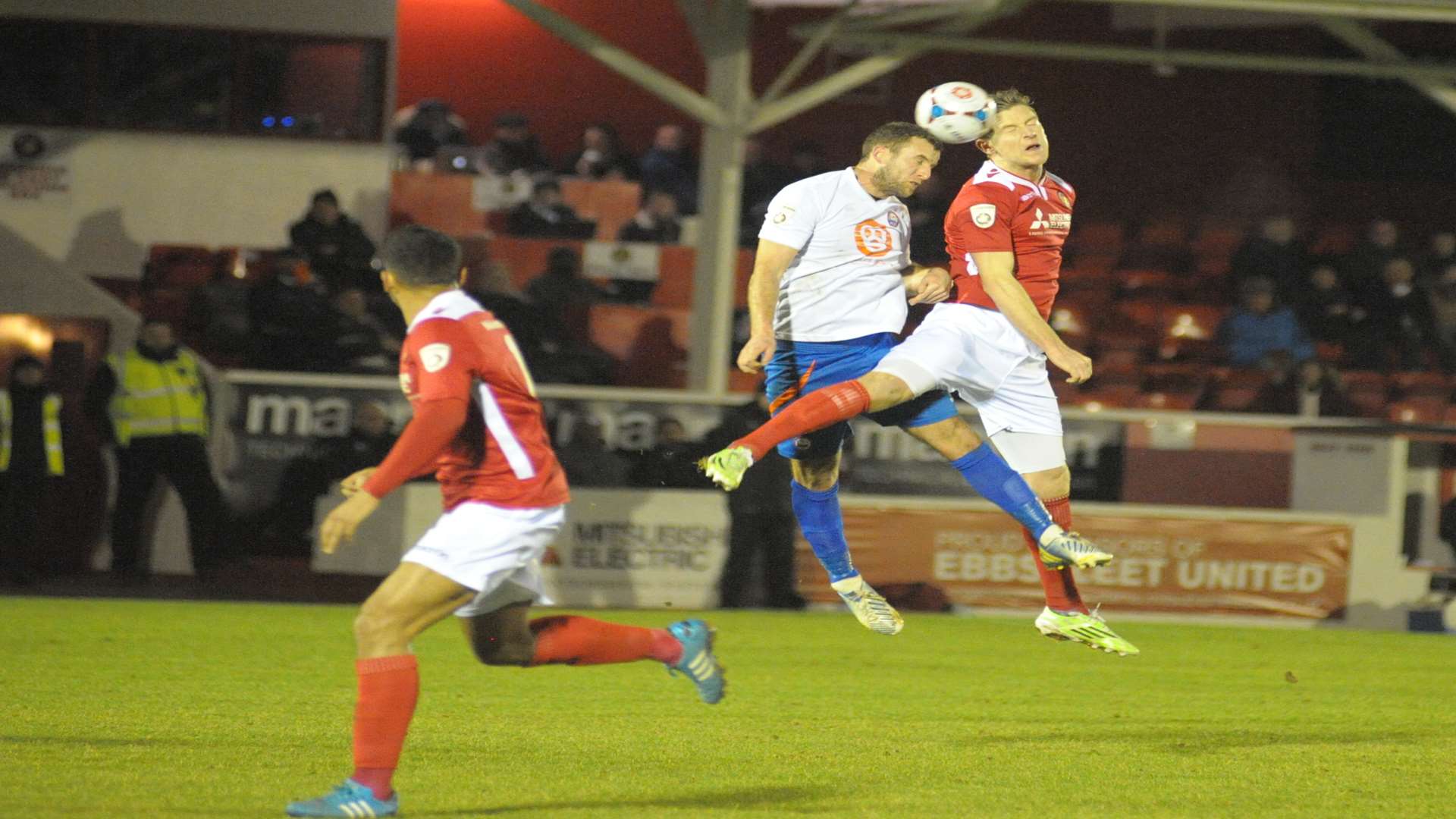 Adam Cunnington tries to flick the ball on for Theo Lewis Picture: Steve Crispe