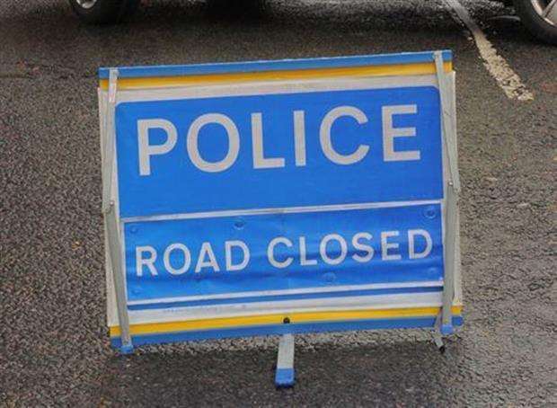 A road has been closed due to a two vehicle collision.