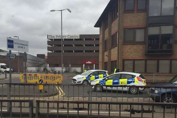 Police at the entrance to the car park. Picture: Samm Hay on Twitter.