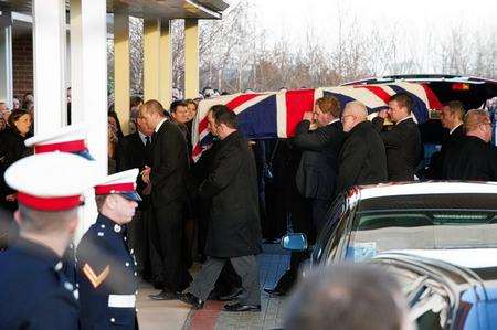 Carl Davies' coffin is carried into the Garden of England crematorium in Bobbing
