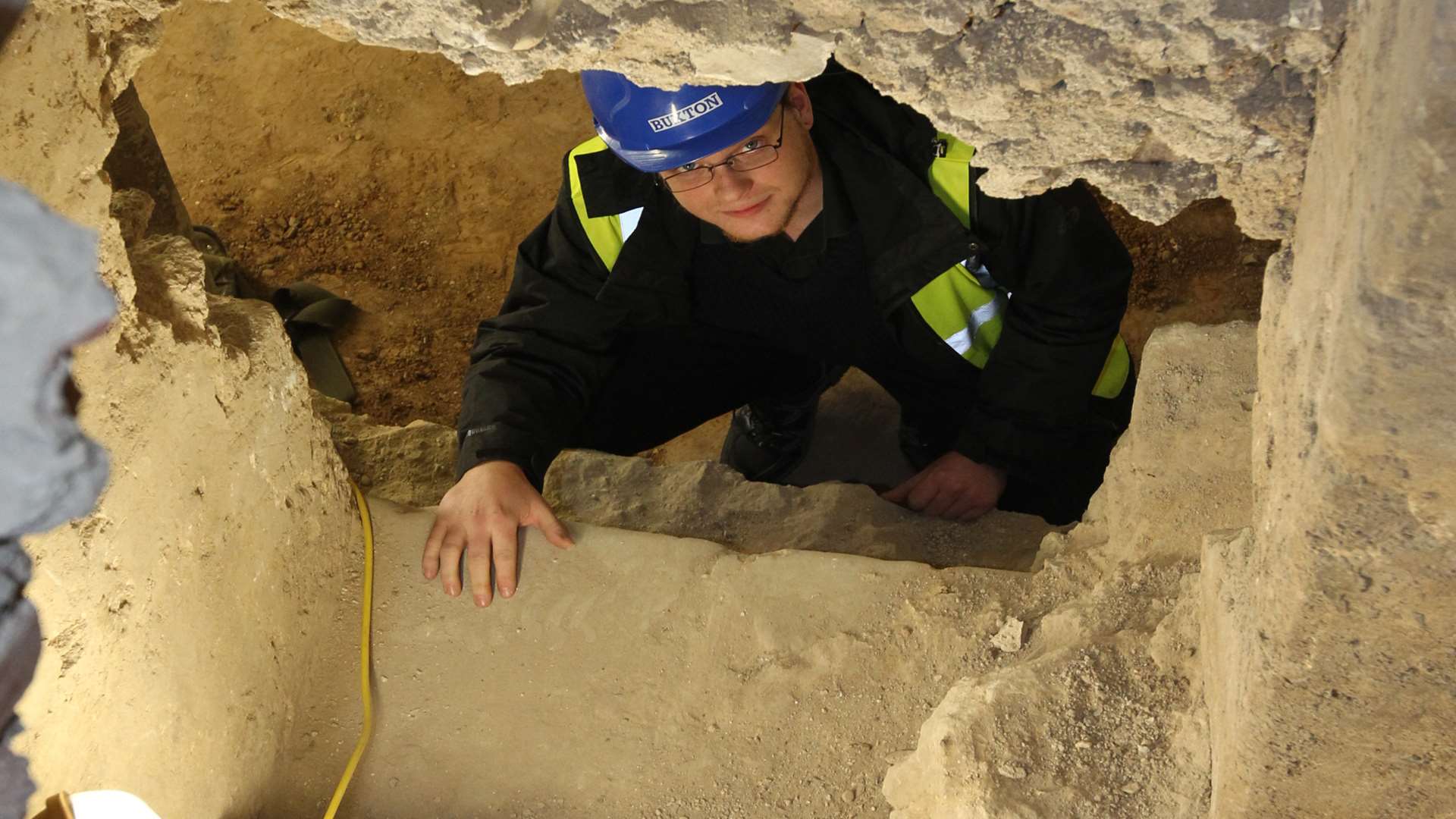 Jacob Scott, Member of Vergers Team shows the remnants of a Norman staircase that the cathedral is preserving in the crypts of Rochester cathedral.