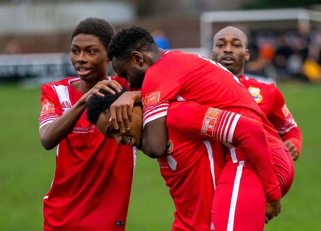 Stephen Okoh celebrates his goal against his old club with his Whitstable team-mates during their 2-1 win at Faversham on Monday. Picture: Les Biggs