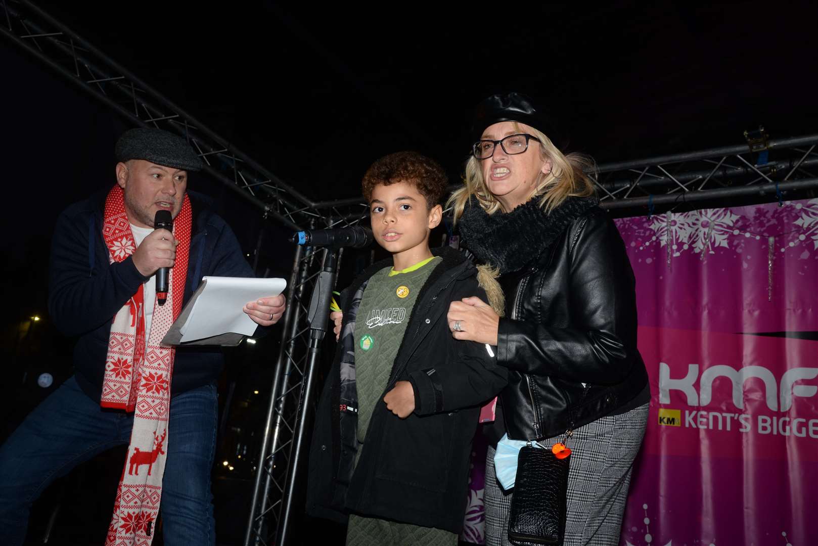 kmfm's Garry Wilson poses questions for Leo Villiers-Bellot, eight, and his auntie Sam Draper. Picture: Chris Davey