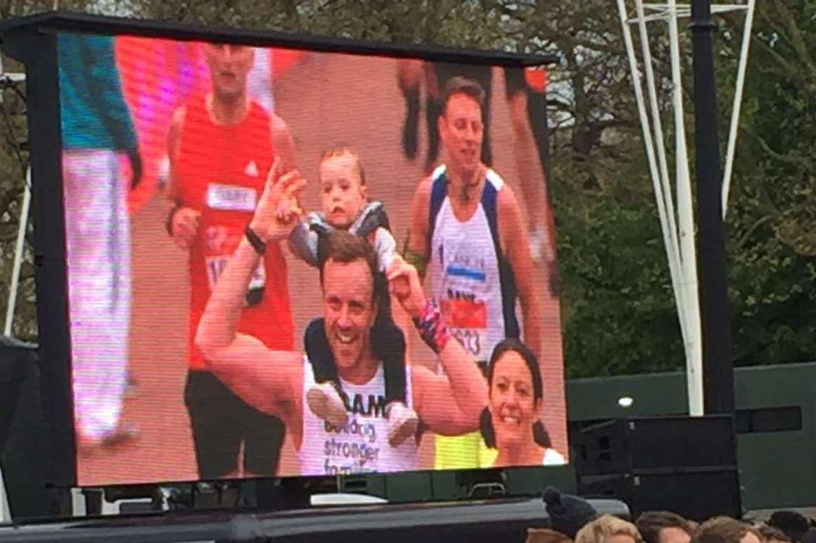 Adam and Joshua on the big screen as they crossed the finish line