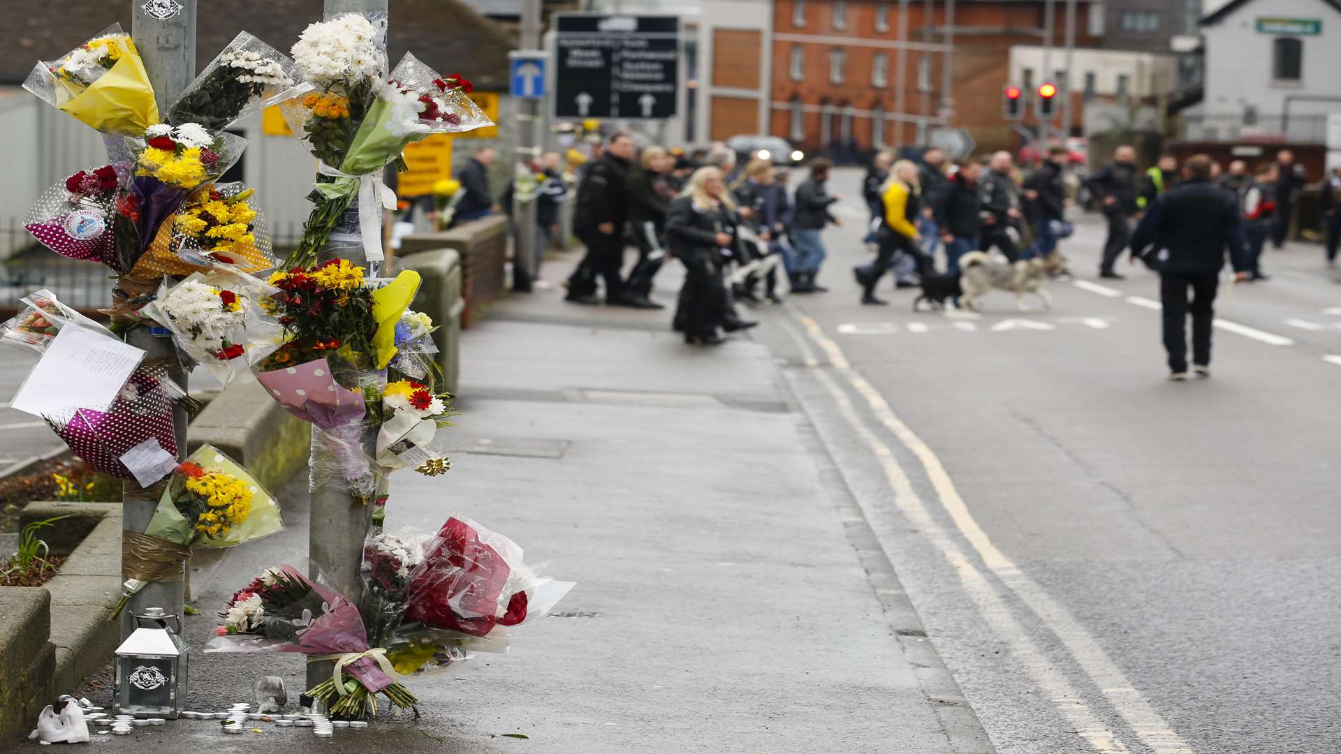 Tributes left to Ozzy as friends walk from the Powerhub to the site of the crash