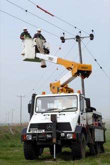 UK Power Networks engineers fitting diverters to power lines