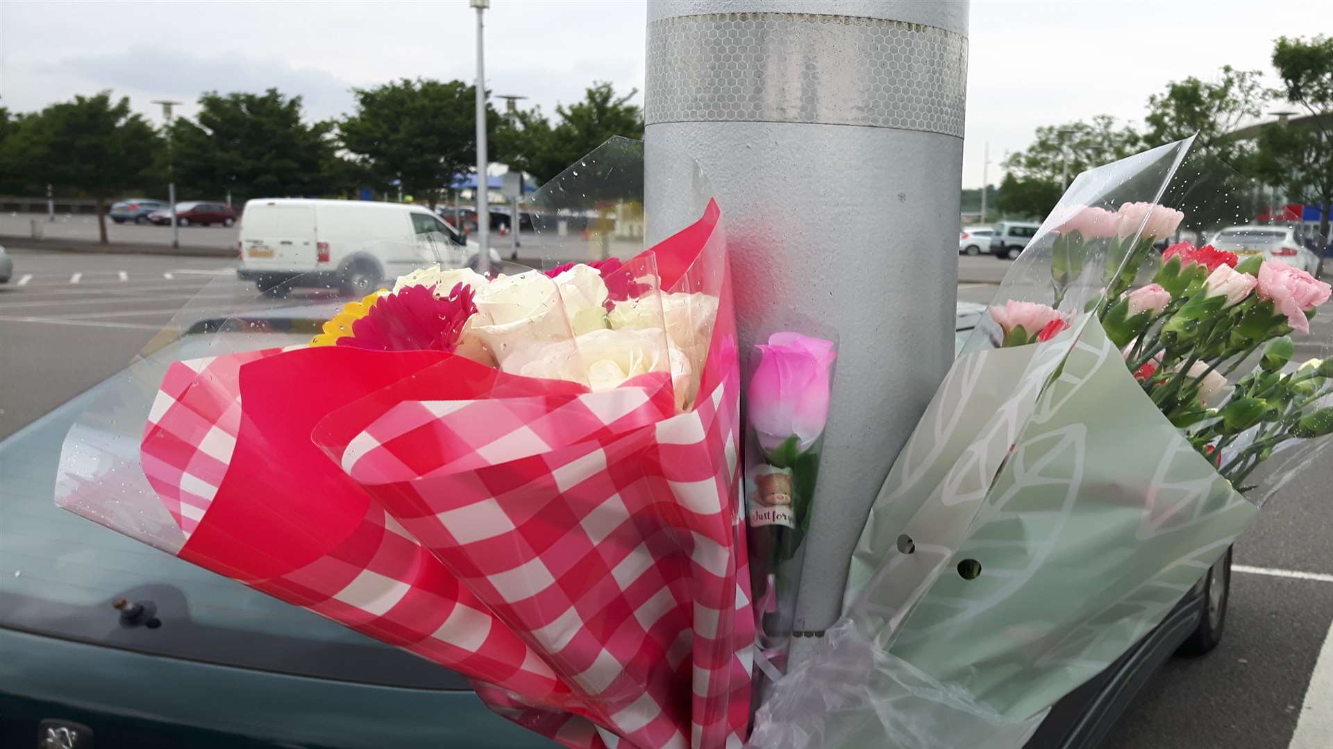 Flowers have been left at the scene of the Dockside Outlet death