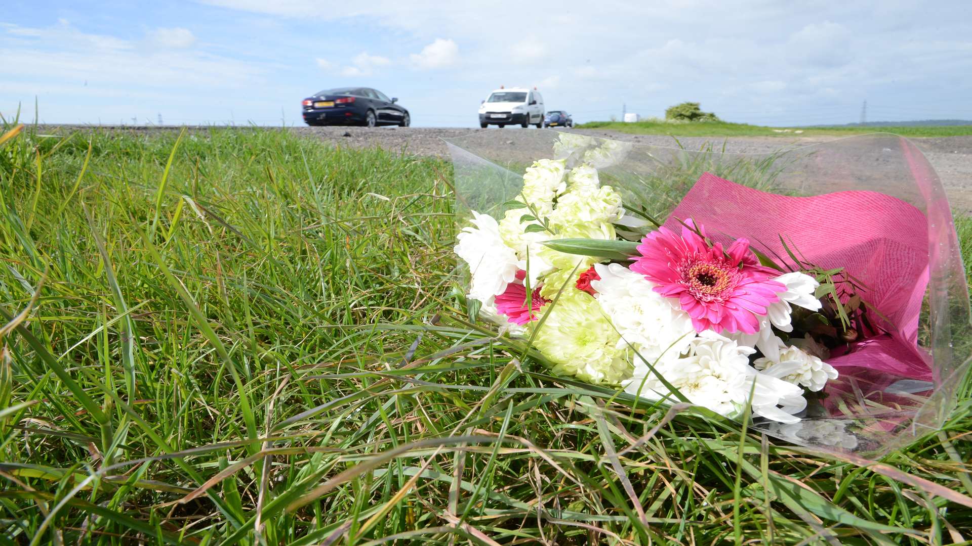 Flowers have been left on the side of the road where the triple fatal crash took place.