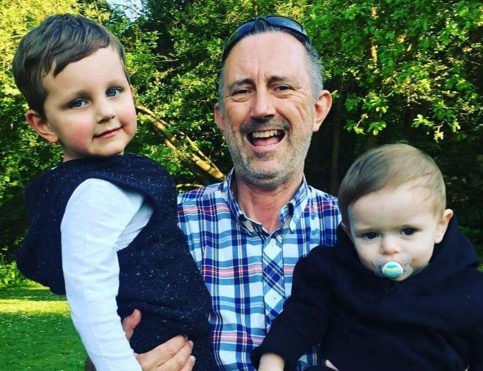 Paul Perkins with his grandchildren, Ronnie and Jacob