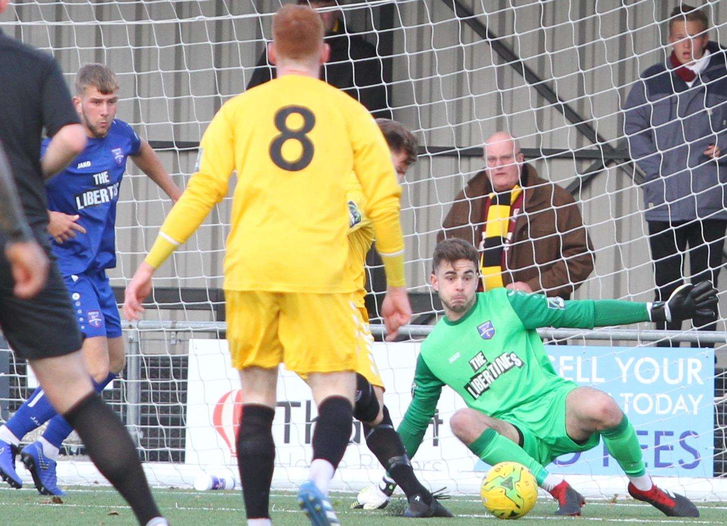 Margate keeper Henry Newcombe gets down to make a block against Potters Bar Picture: Don Walker