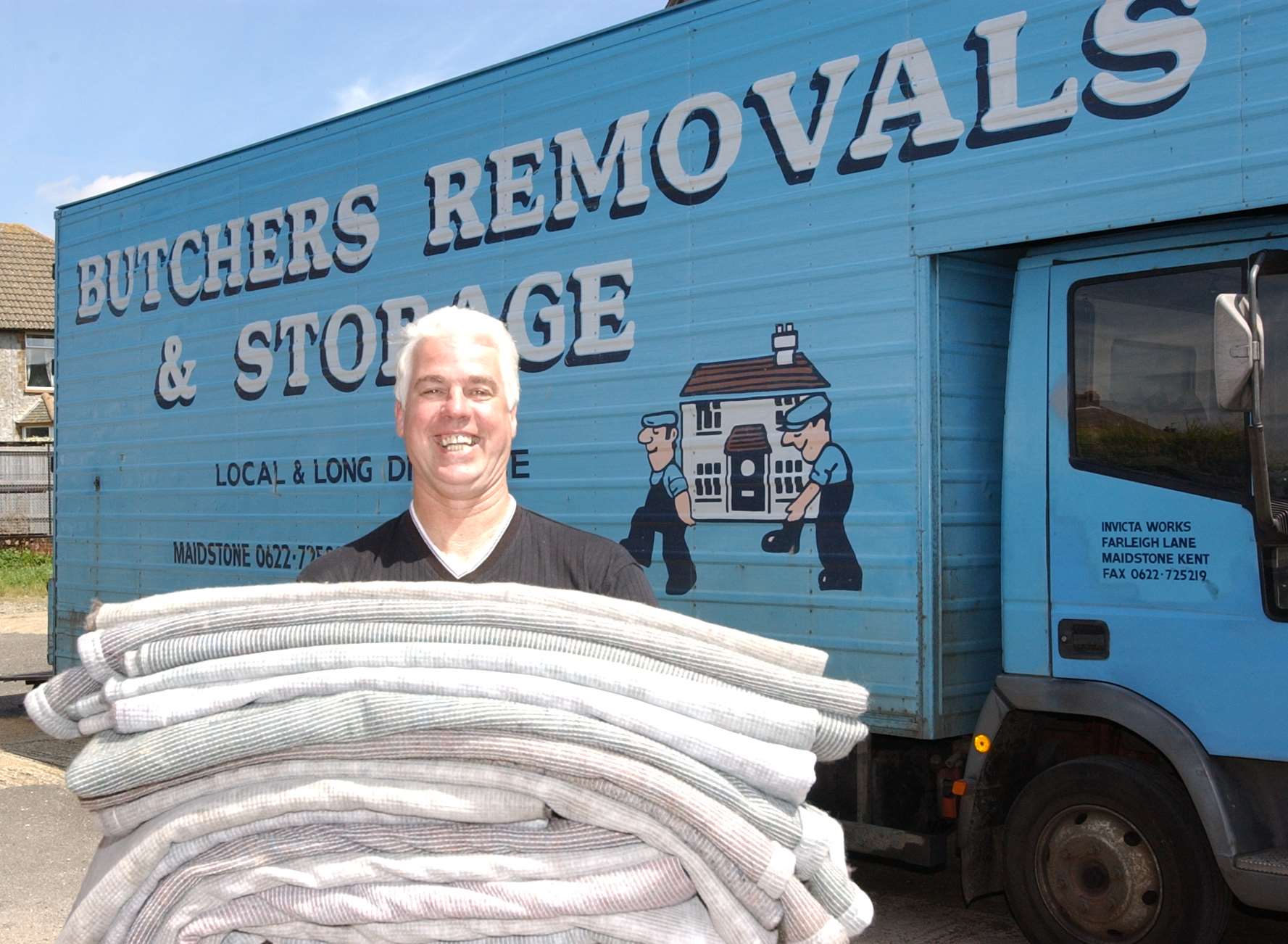 Paul Butcher ran Butchers Removals. Pictured here in 2002 with blankets collected for Eastern Europe