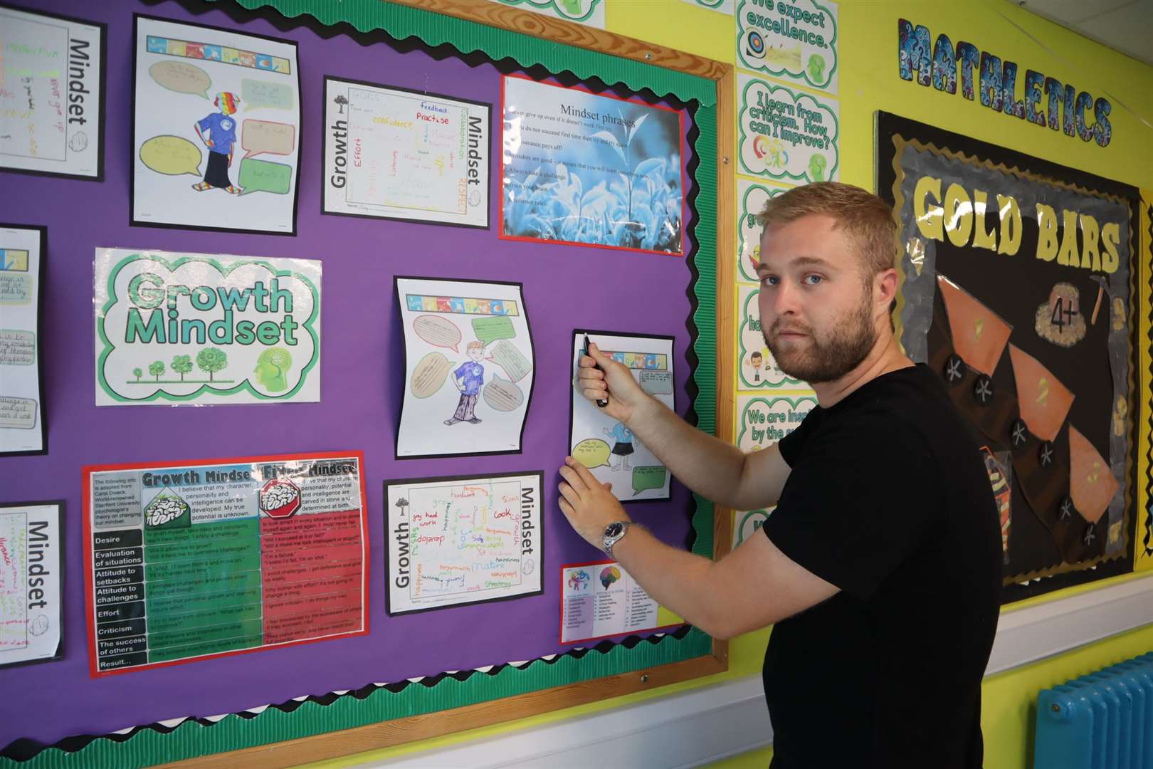 Oliver Jeffery starts stripping the walls in Kookaburra Class at Minster Primary School