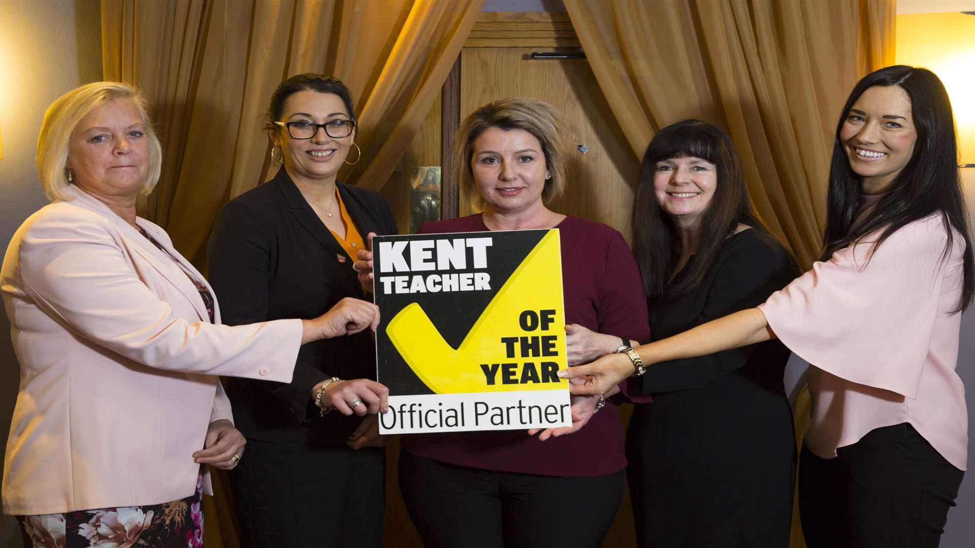 Debbie Lloyd from CXK , Leah Macdonald from Three R's Teacher Recruitment, Kirsty Hawkins from Social Enterprise Kent, Alison Cogger from Canterbury Christ Church University, and Julia Inshaw from CXK show their support for the Kent Teacher of the Year Awards 2018.