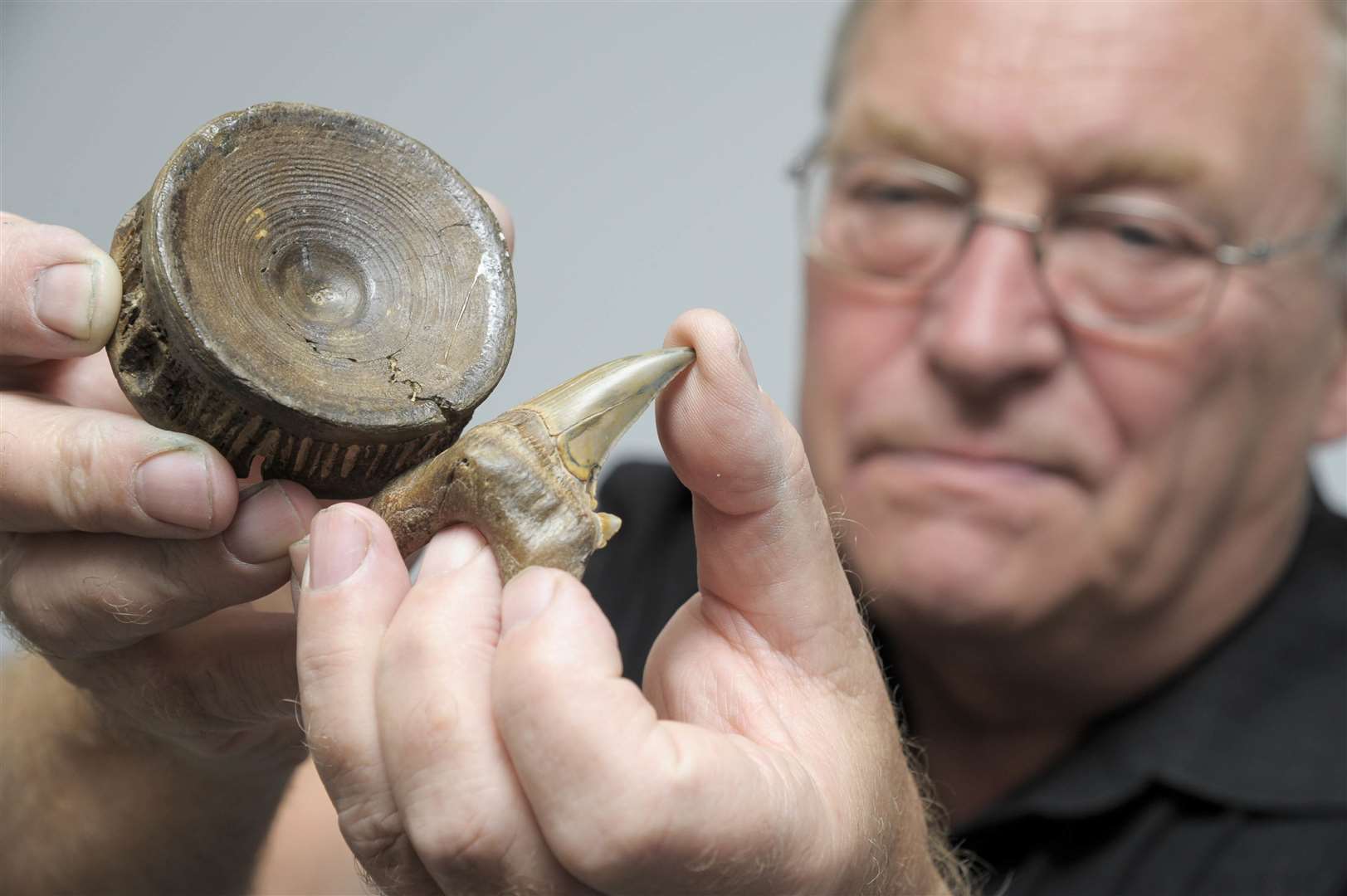 Fred Clouter with fossilised vertebra and tooth from a shark Otodus Obliquus found on Sheppey. Picture: Andy Payton